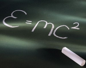 A chalkboard displays Albert Einstein's equation for special relativity.